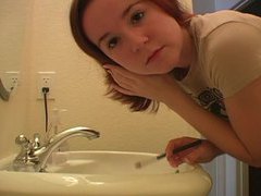 FreeKiloClips presents: Redhead in tee shirt does her makeup