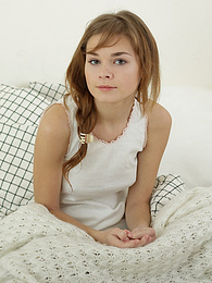 FreeKiloClips presents: Sweet teen brunette stripping naked in the bed